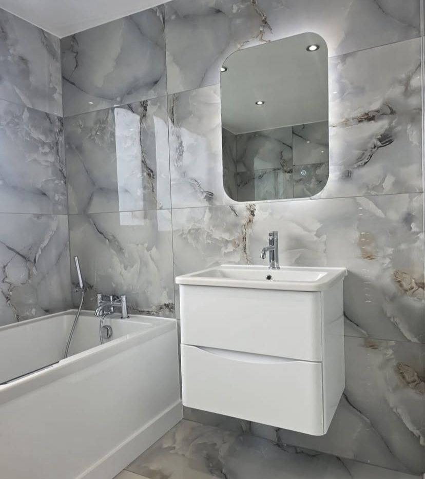Glossy Sky Blue Tile: Serene grey tile with a hint of blue