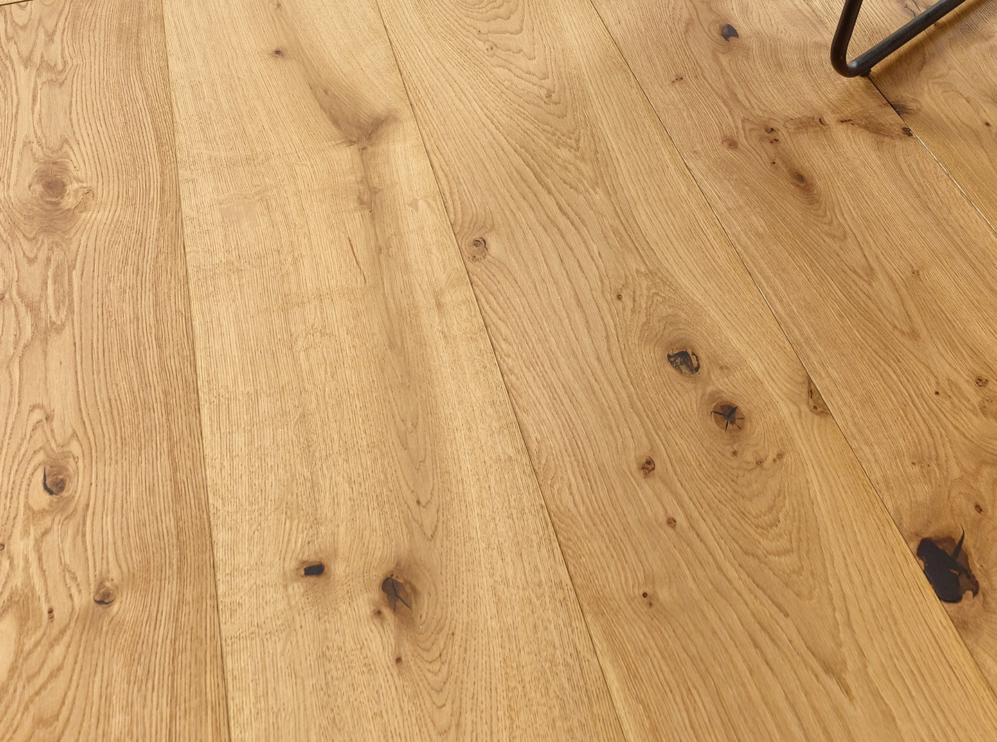 Engineered wood panel oak flooring with brushed texture and natural oil finish highlighting authentic grain and knots