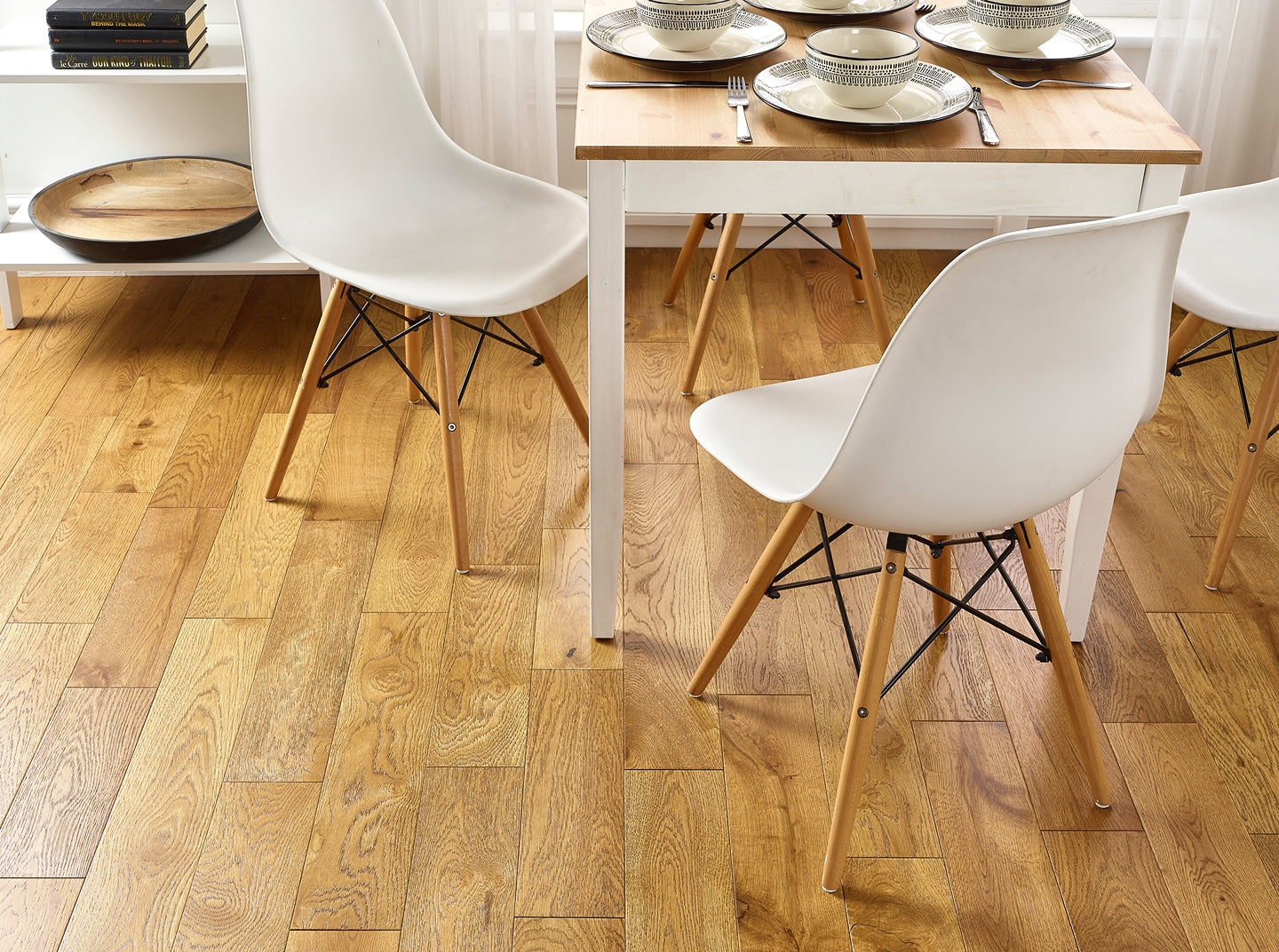 Golden brushed and lacquered engineered wood flooring with warm oak grain finish.