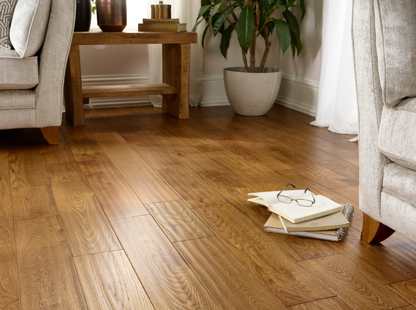 Golden handscraped lacquered engineered wood flooring with rich grain and rustic character, flooring online.