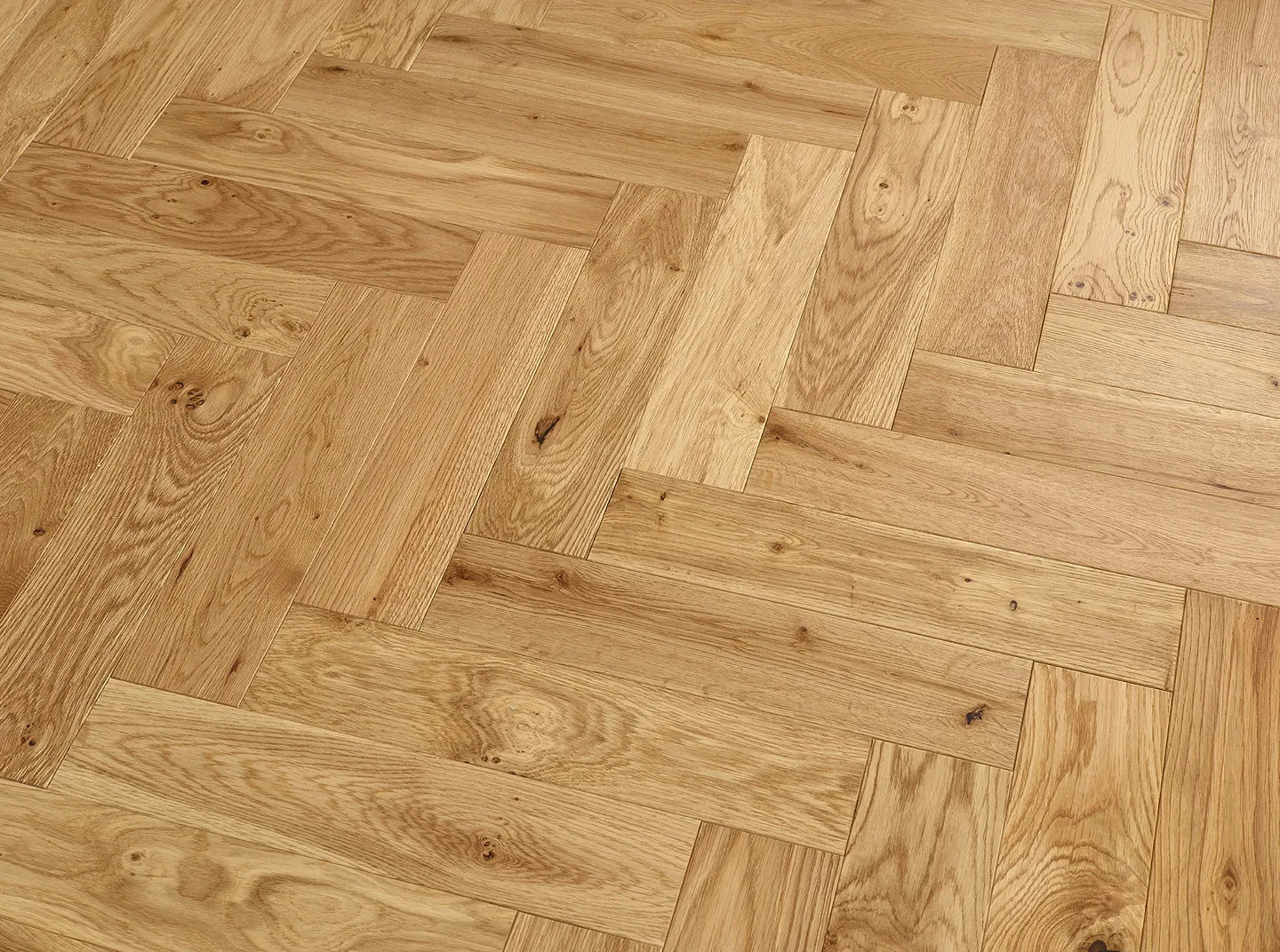 Herringbone Engineered Oak Flooring with 4mm solid wood top, brushed texture, and long-lasting lacquered finish.