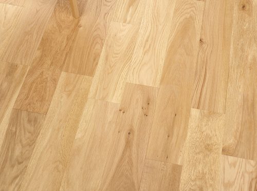 Herringbone engineered wood flooring with brushed oak grain and oiled finish.