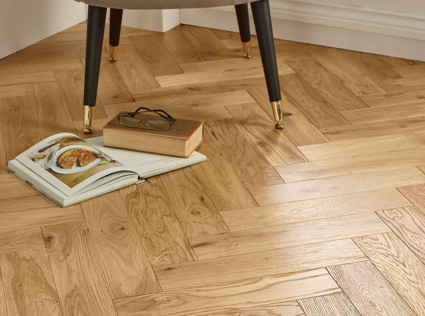 Natural Brushed & Lacquered Engineered Wood Flooring with herringbone design and durable oak top layer.