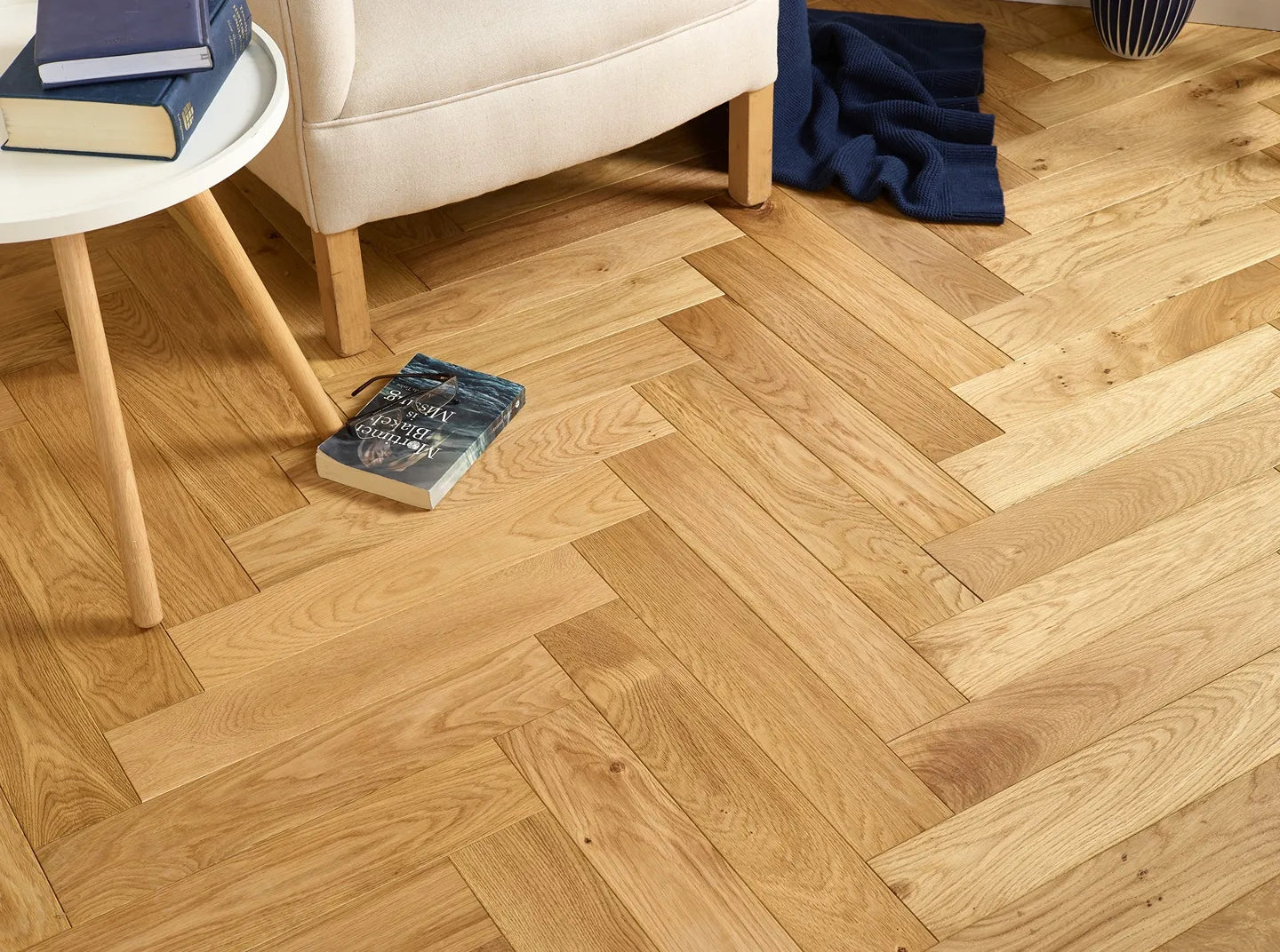 Natural brushed and oiled engineered wood flooring in herringbone pattern for elegant interiors.