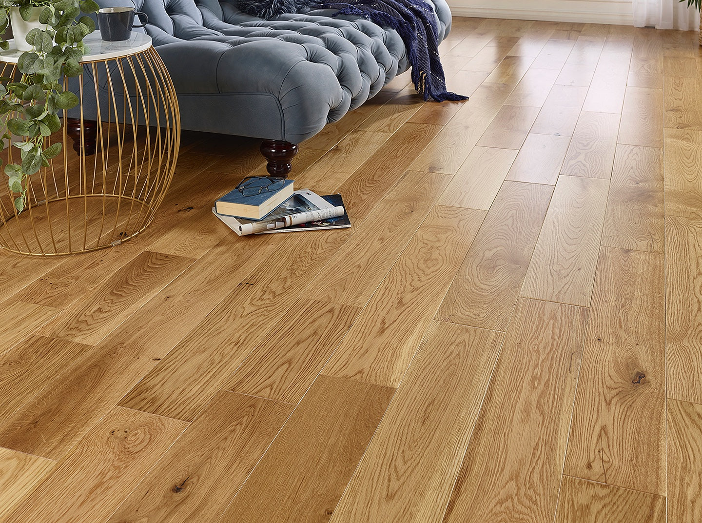 Natural UV lacquered oak engineered wood flooring with wide plank matte finish for modern interiors.