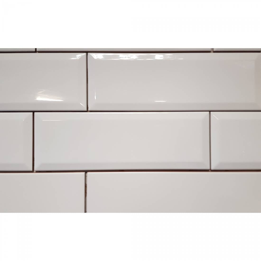 Neutral white gloss porcelain wall and floor tiles for bright contemporary interiors