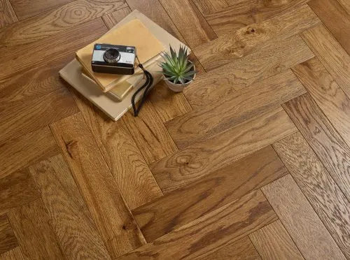 Premium cognac engineered wood flooring with brushed texture and lacquered finish.