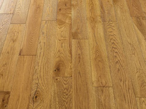 Premium golden oak engineered wood flooring with durable lacquered surface.