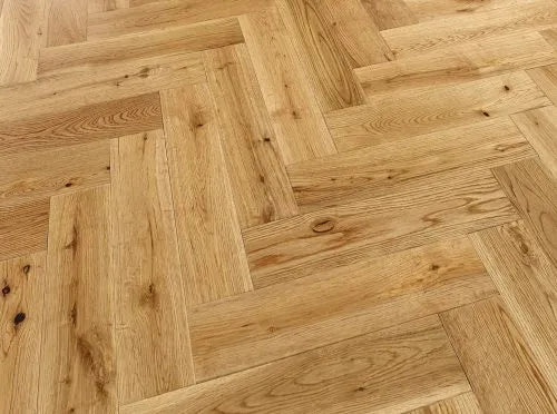 Premium oak engineered wood flooring with herringbone pattern, smooth UV finish, and long-lasting protection.