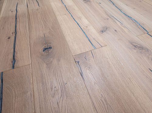 Brushed lacquered oak engineered wood flooring, 220mm wide planks with unique knots and hardwax oil finish.