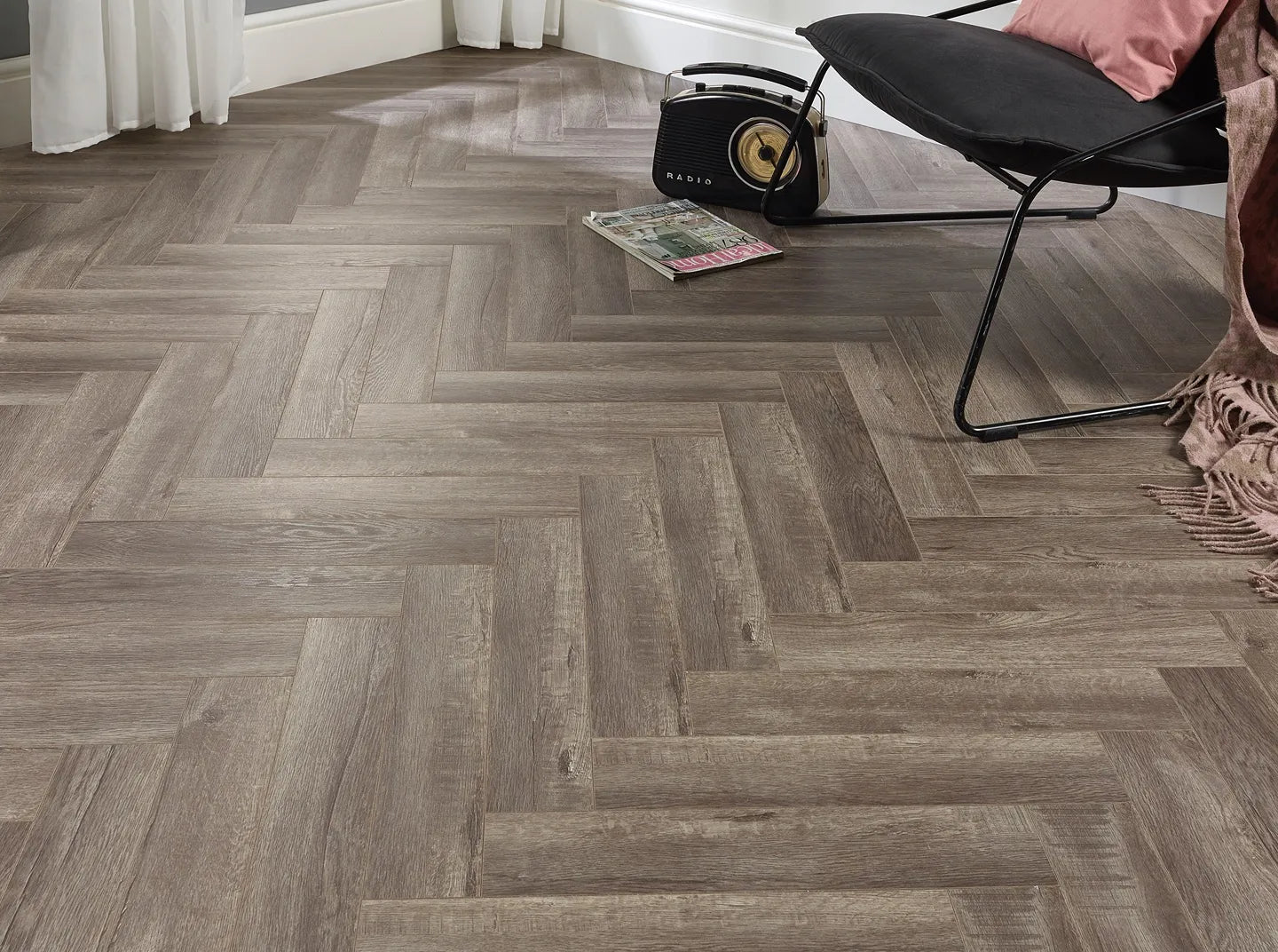 Copenhagen block herringbone laminate flooring in grey with porcelain wall and floor tiles