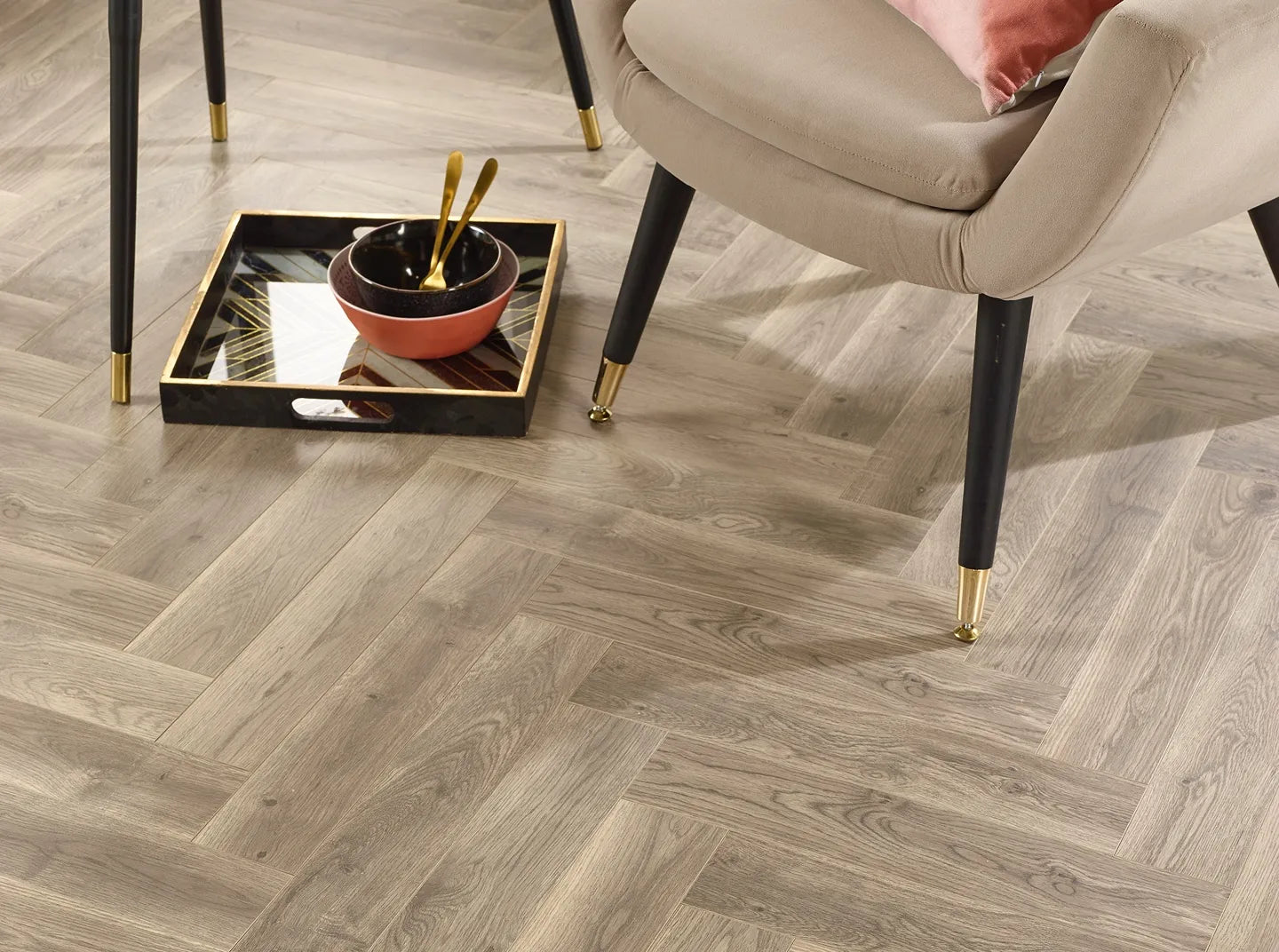 Oslo herringbone laminate flooring with wood effect and porcelain wall and floor tiles