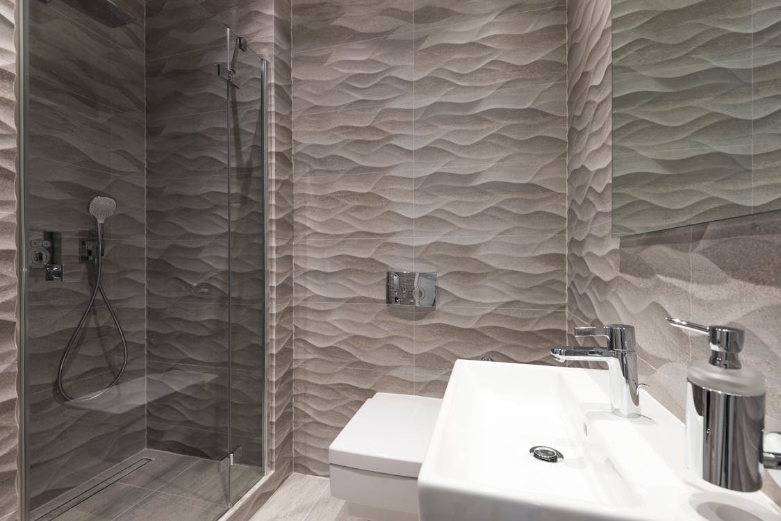 Fabulous marble tile textured shower room.