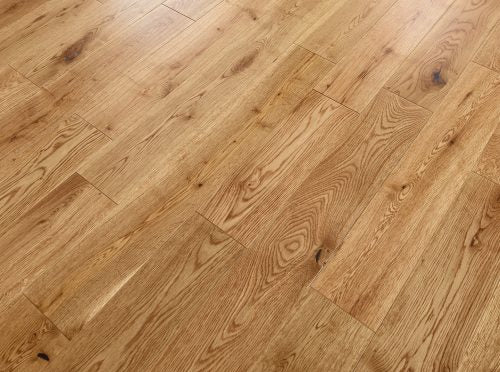 Premium engineered wood flooring highlighting natural oak grain with lacquer finish.