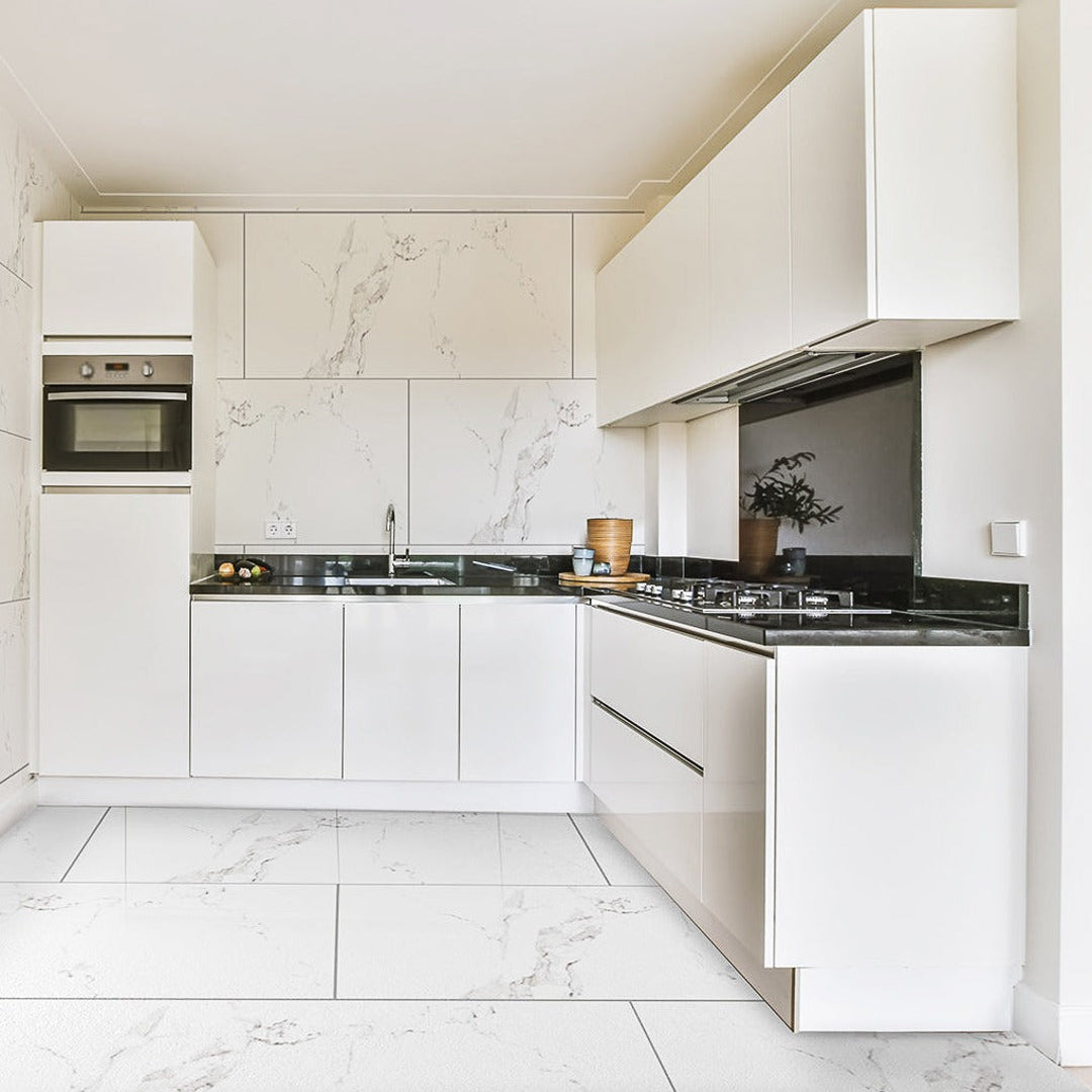 Satvario Bianco White Porcelain Wall And Floor Tiles with soft gray marble effect veins.